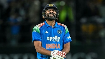 India's Rohit Sharma reacts after being hit by the ball during the first one-day international (ODI) cricket match between India and Afghanistan (AFP)