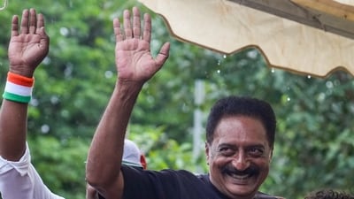 Actor Prakash Raj greets the gathering during a protest by Cockroach Janta Party (CJP) demanding the resignation of Union Education Minister Dharmendra Pradhan over the NEET paper leak and irregularities related to CBSE's on-screen marking system, at Freedom Park, in Bengaluru. (PTI)