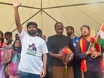 Cockroach Janta Party (CJP) founder Abhijit Dipke, actor Prakash Raj and climate activist Sonam Wangchuk during a protest by CJP demanding the resignation of Union Education Minister Dharmendra Pradhan over the NEET paper leak and irregularities related to CBSE's on-screen marking system, at Freedom Park, in Bengaluru on Sunday. (PTI)