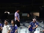 Japan supporters leave after the World Cup Group F football match between the Netherlands and Japan at the Dallas Stadium in Arlington.