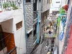 The fire began in the ground-floor parking area and smoke filled the five-storey building within minutes, trapping residents on the upper floors.