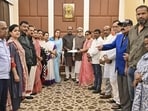 Lok Sabha Speaker Om Birla (in the middle) receives a letter from rebel TMC MPs for separate seating arrangement in the House, in New Delhi on Sunday. (Handout)
