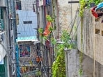 Narrow lanes lined with overhead wires near the residential building in Tughlakabad Extension, where three people were killed in a massive fire. (Vipin Kumar/HT Photo)
