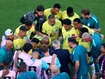 Brazil coach Carlo Ancelotti gives instructions to players during a hydration break