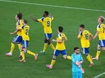 Sweden's Mattias Svanberg, left, celebrates with Alexander Bernhardsson (21) and Alexander Isak (9) after scoring their fourth goal during the World Cup Group F soccer match