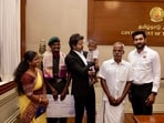 Tamil Nadu chief minister Vijay with Lance Naik Meenatchi Sundaram A and his family. 