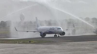 An IndiGo flight receives a water cannon salute as commercial flight operations kick off at Noida International Airport, in Jewar on Monday. (ANI VIDEO GRAB) An IndiGo flight receives a water cannon salute as commercial flight operations kick off at Noida International Airport, in Jewar on Monday. (ANI VIDEO GRAB)