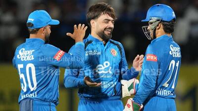 Rashid Khan celebrates a wicket in the match against India at Dharamsala. (AP)