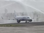 An IndiGo flight receives a water cannon salute as commercial flight operations kick off at Noida International Airport, in Jewar on Monday. (ANI VIDEO GRAB)