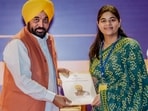 Chief Minister Bhagwant Mann hands over an appointment letter to a youth in Punjab. (PTI) Chief Minister Bhagwant Mann hands over an appointment letter to a youth in Punjab. (PTI)