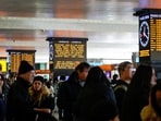Passengers wait inside Termini train station after train services in Italy were disrupted during the Olympics, at a railway station in Rome, Italy, February 14, 2026. 