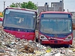 Non-functional city bus service buses dumped in a yard on Hambran Road in Ludhiana on Tuesday. (Gurpreet Singh/HT)