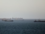 Tankers and cargo vessels are seen in the Gulf of Oman, along shipping routes linking the Strait of Hormuz and the Arabian Sea, June 16, 2026. 
