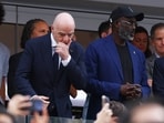 FIFA President Gianni Infantino and former player George Weah in the stands during the match