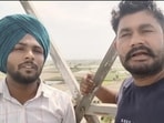 The two unemployed teachers who were arrested after they climbed a mobile tower at Satauj, the native village of Punjab chief minister Bhagwant Mann, in Sangrur district on Monday. (HT Photo)