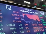 Dow Jones hit a record high after rising nearly 400 points. (Photo by Michael M. Santiago / GETTY IMAGES NORTH AMERICA / Getty Images via AFP)