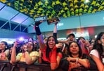 Fans cheering for performers at the event 