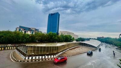Commuters on the road amid light rain at Sector-17 near IMD chowk in Gurugram. (Parveen Kumar/ HT Photo) Commuters on the road amid light rain at Sector-17 near IMD chowk in Gurugram. (Parveen Kumar/ HT Photo)
