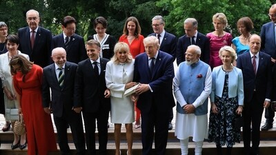 Swiss's President wife Caroline Merotto, Japan's Prime minister Sanae Takaichi, Swiss President Guy Parmelin, Brazil's First Lady Rosangela "Janja" da Silva, Brazil's President Luiz Inacio Lula da Silva, South Korea's President Lee Jae-myung, France's President Emmanuel Macron, South Korea's First Lady Kim Hea Kyung, French President's wife Brigitte Macron, British Prime Minister's wife Victoria Starmer, US President Donald Trump, Britain's Prime Minister Keir Starmer, India's Prime Minister Narendra Modi, Canada's Prime Minister Mark Carney, Canadian Prime Minister's wife Diana Carney, European Commission President Ursula von der Leyen, German Chancellor's wife Charlotte Merz, European Commission President's husband Heiko von der Leyen and Germany's Chancellor Friedrich Merz pose for a family photo prior to a gala dinner as part of the G7 summit in Evian-les-Bains. (via REUTERS)