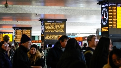 Passengers wait inside Termini train station after train services in Italy were disrupted during the Olympics, at a railway station in Rome, Italy, February 14, 2026. (REUTERS)