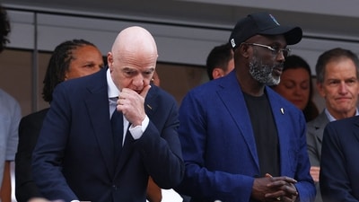 FIFA President Gianni Infantino and former player George Weah in the stands during the match (REUTERS)