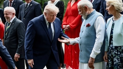 India's Prime Minister Narendra Modi offers a hand to U.S. President Donald Trump during a family photo before a cultural performance and concert during the G7 summit, in Evian-les-Bains, France, June 16, 2026. (REUTERS)