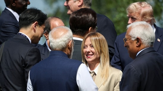 Italy's Prime Minister Giorgia Meloni (C-R) speaks with India's Prime Minister Narendra Modi (C-L) before a family photograph during the G7 summit, in Evian, eastern France, on June 16, 2026. A G7 summit is set to take place June 15 to 17 in the French town of Evian-les-Bains near Switzerland and it will be attended by country leaders as well as the EU's foreign policy chief and ministers from Brazil, Canada, the United Arab Emirates and Turkey.(AFP)