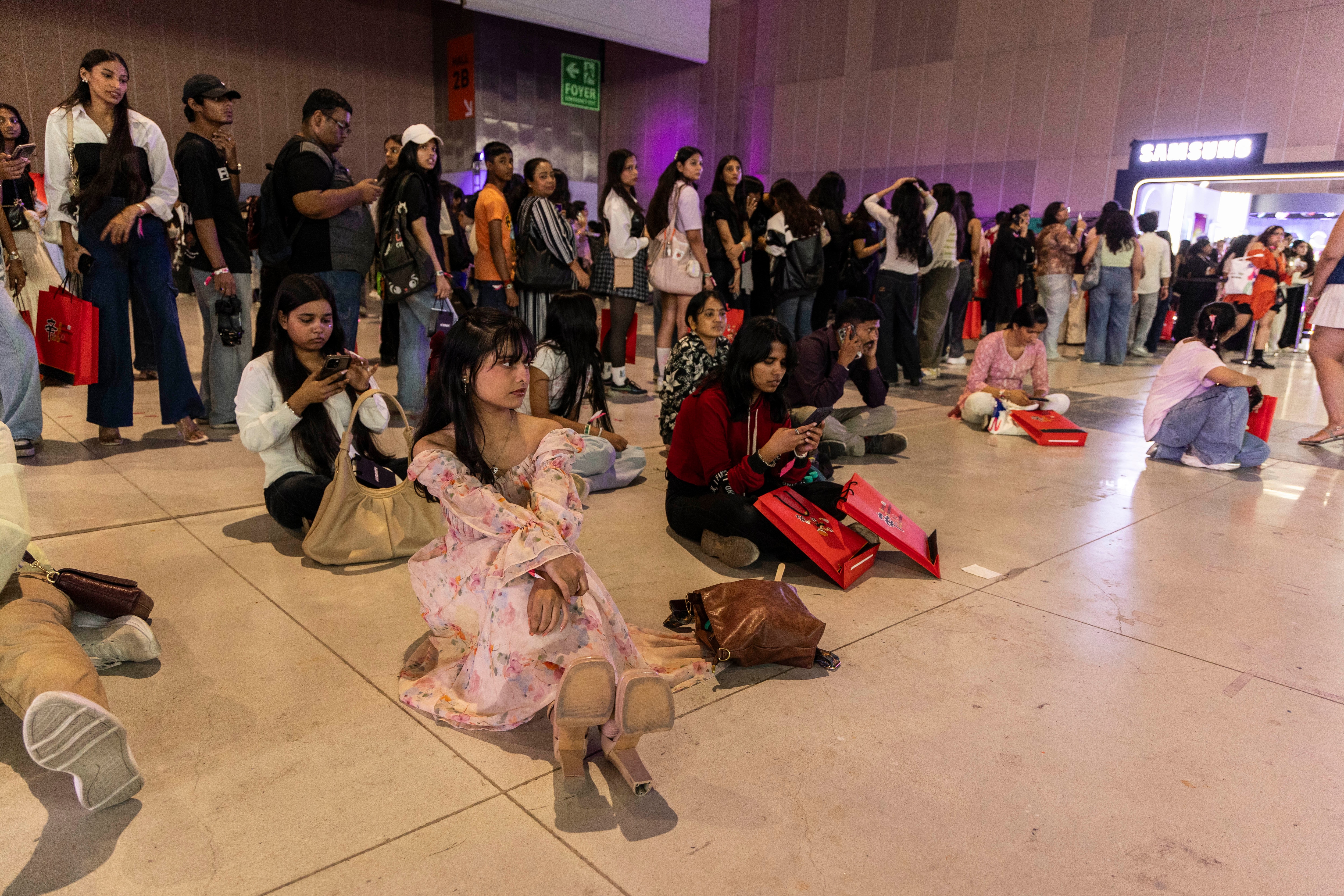 Krisha, sitting with other attendees