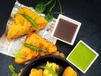 'Bread pakoda' served on a newspaper.