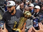 New York Knicks center Karl-Anthony Towns leaves the court with the Larry O'Brien Championship Trophy after defeating the San Antonio Spurs in Game 5 of the NBA Finals basketball series, Saturday, June 13, 2026, in San Antonio. AP/PTI(AP06_14_2026_000084A)