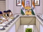 Chief minister Yogi Adityanath chairs a review meeting on International Yoga Day, Moharram, NEET exam and law and order through video conferencing, in Lucknow. (Handout via PTI Photo)