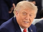 US President Donald Trump reacts during working lunch meeting of G7 members, partner countries, and artificial intelligence business leaders as part of the G7 summit, in Evian, eastern France, on June 17, 2026.