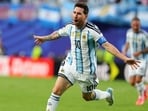Argentina's Lionel Messi (10) celebrates after scoring the opening goal against Algeria.