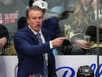 FILE - Los Angeles Kings head coach Jim Hiller directs his players from the team box in the third period of an NHL hockey game against the Colorado Avalanche Dec 29, 2025, in Denver. 
