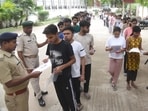 Security persons checking aspirants before appearing in the NEET UG 2026 exam conducted by National Testing Agency (NTA) at an examination centre in Patna.