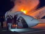 People attempt to pull passengers out of a plane after it crashed on a highway in Laredo, Texas.
