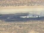 Smoke rises from a blackened part of Edwards Air Force Base after the crash of a U.S. Air Force B-52 bomber aircraft in Edwards, California, U.S., June 15, 2026.(via REUTERS)