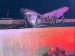Firefighters were seen dousing the crashed plane in Laredo, Texas, in a video shared by the local police department.