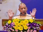 Uttar Pradesh Chief Minister Yogi Adityanath speaks during a programme for distribution of land allotment letters in Lucknow.