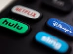 The logo for streaming service Disney Plus pictured on a remote control.