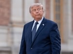 US President Donald Trump arrives for a gala dinner at the Versailles Palace in Versailles, France, where he would later sing the peace deal with Iran
