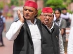From left, Samajwadi Party (SP) MPs Akhilesh Yadav and Awadhesh Prasad.
