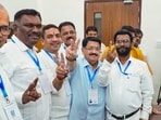 Jharkhand Mukti Morcha (JMM) candidate Baidyanath Ram and NDA-supported Independent candidate Parimal Nathwani show a victory sign after winning in the state Rajya Sabha elections.