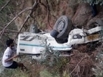 The mangled remains of the vehicle that fell into a gorge near Chhatrund in Chamba district on Wednesday night. (HT Photo)