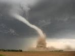 A large, extremely dangerous tornado moves through Charleston, Illinois,