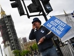 Steve Bray, anti-Brexit protester, shouts slogans while holding a placard that reads "Brexit Got The UK Done" in Westminster in London, UK.