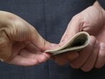 A sub-inspector posted with the Anti-Narcotics Task Force in Jalandhar was caught red-handed while accepting a bribe of  <span class='webrupee'>₹</span>1 lakh on Thursday.