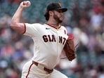Giants pitcher Landen Roupp reportedly inscribed “Gen 9:12-16” on his cap, with part of the scripture reference overlapping the rainbow-colored “SF” logo designed for the event.
