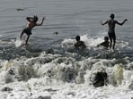 Boys bathe in the Gomti to beat the heat near Kudia Ghat in Lucknow. 