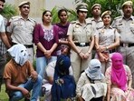 Delhi Police with arrested members of the syndicate. (Vipin Kumar/HT Photo)